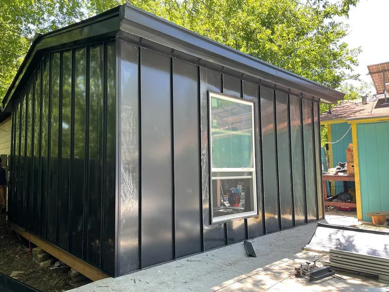 Black standing seam metal wall panels for Metal Roof Installation in Acushnet