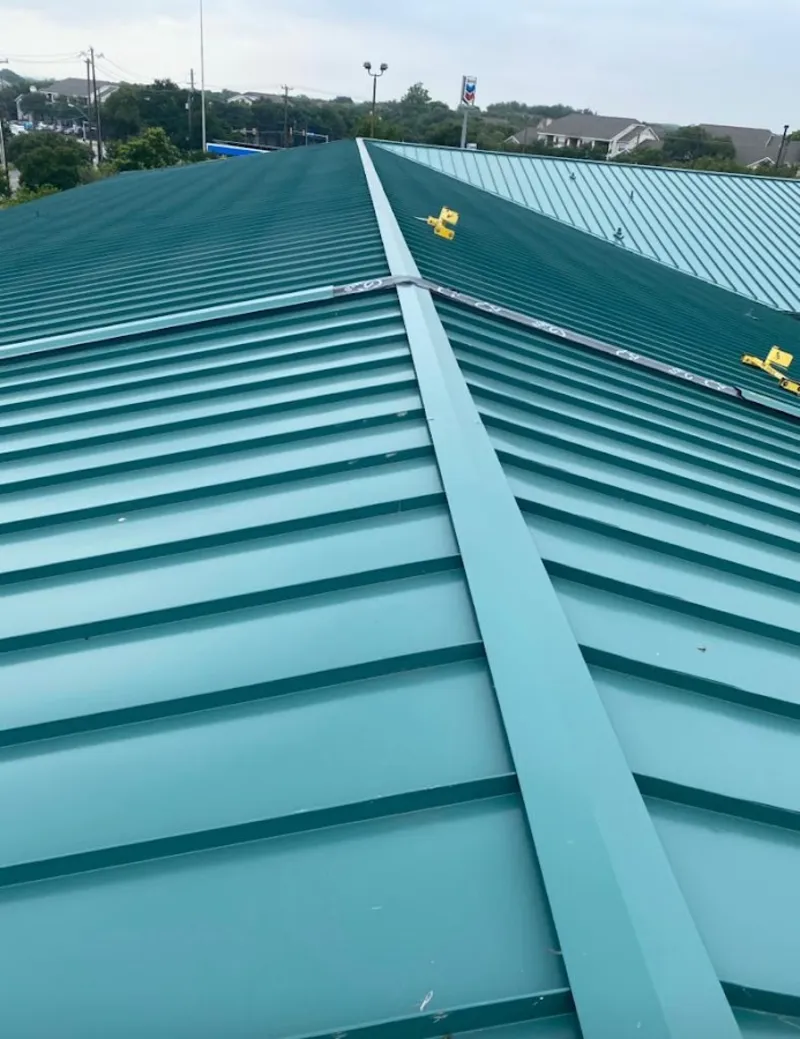 Green commercial metal roof ridge and valley for Metal Roof Repair in Acushnet